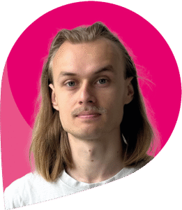 zfm-Teammitglied Sebastian Seifert vor pinkem Hintergrund (umgekehrter zfm-Tropfen)